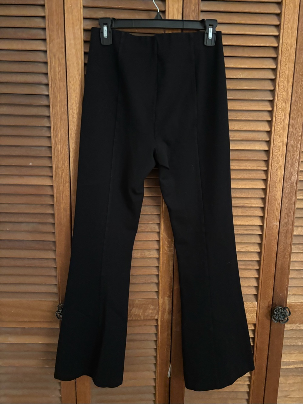 Maje black flare pants, stretch, raised line down front of legs. Size 8-10.